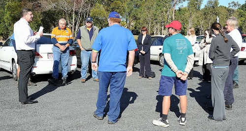 Union spokesman David Perry (left) talks with delegates in the car park of the council chambers in Hervey Bay. Union spokesman David Perry (left) talks with delegates in the car park of the council chambers in Hervey Bay.